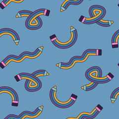 Seamless pattern with colorful pencils on blue background.