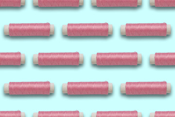 pattern of pink threads on a colored background