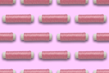 pattern of pink threads on a colored background