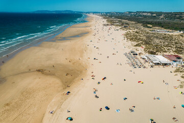 Aerial view of Caparica Beach in Almada District, Greater Lisbon, Portugal on a summer day