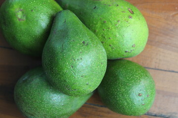 five avocados on the table