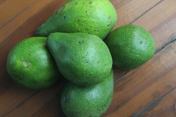 five avocados on the table