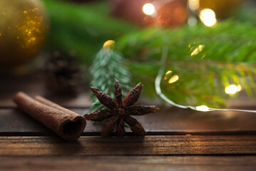 Christmas background with fir tree and decoration on dark wooden board