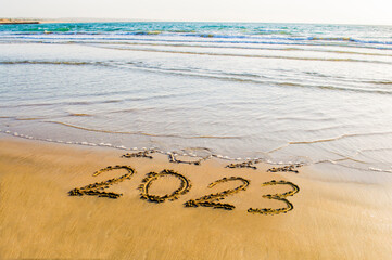 happy new year 2023 on sea beach