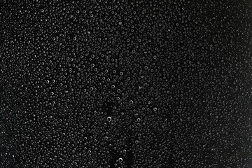 black wet background / raindrops for overlaying on window, concept of autumn weather, background of drops of water rain on glass transparent