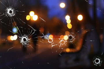 abstract simulation blurred view of the city bullet holes on the window glass, shooting war...