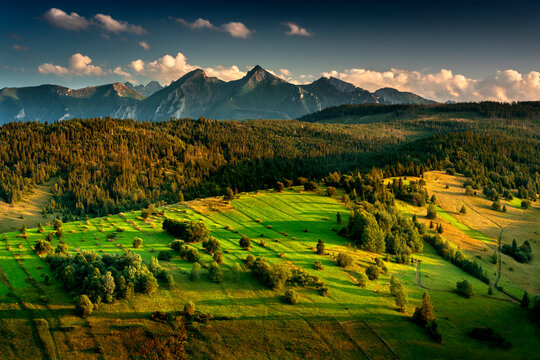 View of the Tatra Mountains from Osturna in Slovakia. Summer, mountain, glade. Widok na Tatry z Osturni na Słowacji. Lato, g&oacute;ra, polana. 
