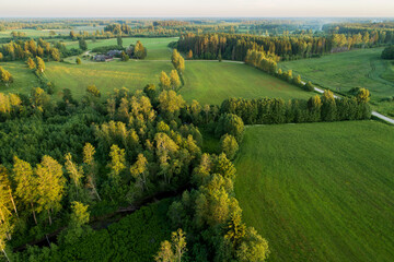 An aerial view to mosaic rural landscape with fields and forests in Estonia, Northern Europe. 