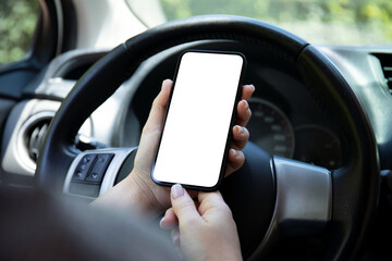 female hands hold phone with isolated screen background in car