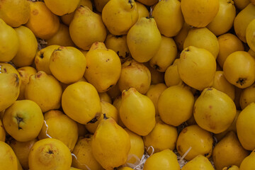 yellow pears on market stall