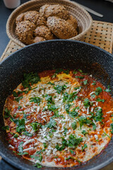 Israeli dish from eggs with tomato sauce - Sakshuka