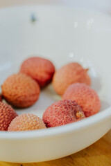 Fresh lychee fruits on a plate