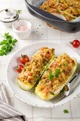 Zucchini stuffed with minced meat and tomatoes and cheese.