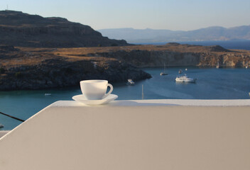 Sea and morning cup of coffee, Lindos, Greece.