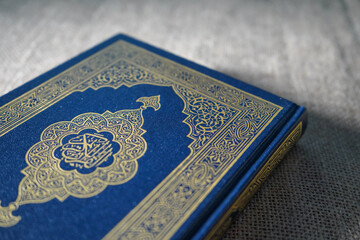 Fototapeta premium The Quran, also romanized Qur'an or Koran, is the central religious text of Islam, believed by Muslims to be a revelation from God (Allah).It is widely regarded as the finest work in classical Arabic