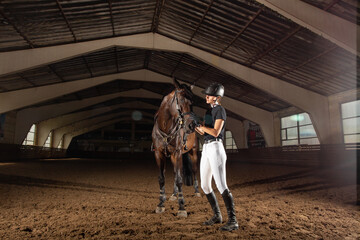 Equestrian sport - a young girl with her horse.