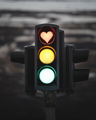 Heart shaped stop light in traffic signal. Red light displaying love symbol. Akureyri, Northern Iceland.