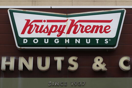 CHIBA, JAPAN - May 10, 2019: A sign on the wall of a Krispy Kreme Doughnuts store located in Funabashi's LaLa Port shopping mall.