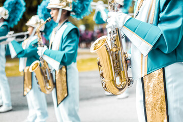 Group of students saxophone, School band performs in marching band