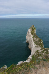 The cliff of Falaise d'Amont on a summer day in Etretat, Normandy, France