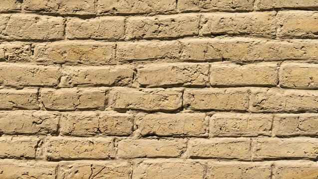 Old adobe bricks wall made of mud.Useful for backgrounds and texture.