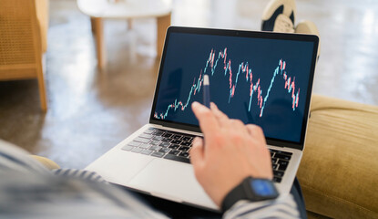 Laptop screen stock exchange stock rise and fall charts, investor trades online
