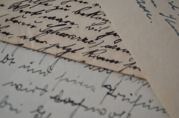 handwritten letter with a feather