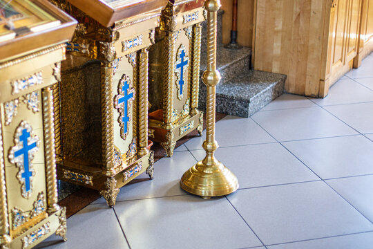 close-up of the lower part of the altar in the catholic and orthodox church with a cross, the background is blurred