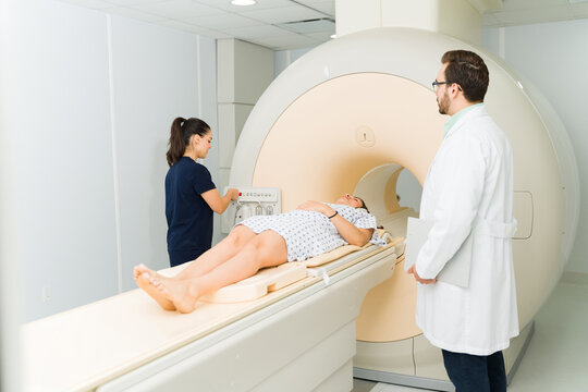 Technician radiologist starting a resonance medical test at the hospital