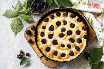 Homemade blackberry pie. Vegan gluten-free pastry. Sweet pie with blackberry and custard on stone...