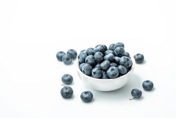 Bowl of fresh Blueberries isolated on white background