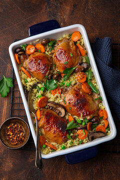 Oven Baked Chicken Thighs With Rice And Vegetables