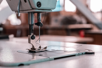 Sewing machine needles close-up in the workshop