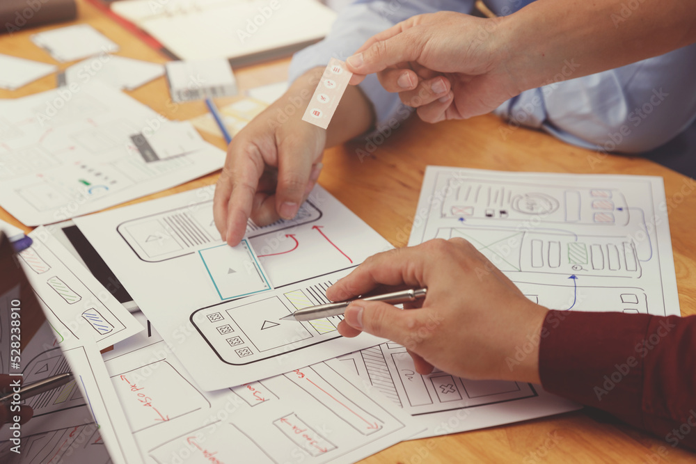 Wall mural ux ui concept, graphic designers work together with ux ui designer planning application template lay
