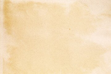 Old yellowed kraft paper with white stains