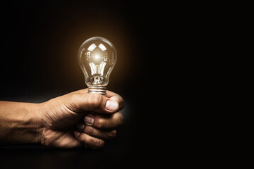 Close up hand choose light bulb or lamp for human resources or leadership and creativity thinking idea motivation or vision and knowledge learning and study or education concept. © Jintana