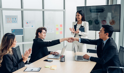 Group of professional business people are working and shaking hands while working in the creative office.