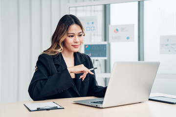 Successful asian businesswoman working and looking camera at her office desk, Concept of business risk analysis and assessment