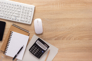 Manager or student workplace and notebook with stationary supplies on desk table background © Sergii Moscaliuk
