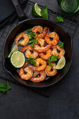 spicy roasted shrimps in cast iron pan