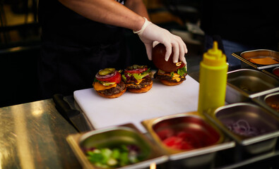 three freshly cooked burgers