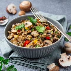 Warm pearl barley salad with mushrooms and vegetables