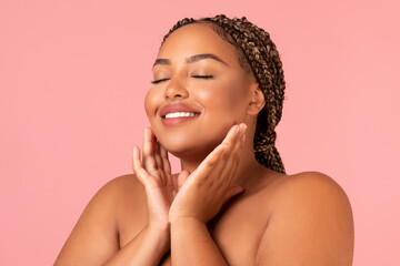Happy Oversized Black Female Touching Face Over Pink Studio Background - Powered by Adobe