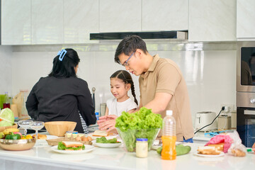 Family Cooking Time Concept , Father and daughter make a sandwich in home kitchen