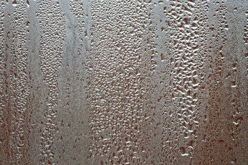 Raindrops and condensation on window, firsts frosts