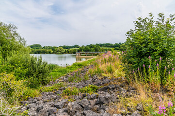 A view along the barriage at Boddington Reservoir, Northampton, UK in summertime
