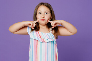 Little kid child girl 5-6 years old wear dress point index fingers blow puff cheeks with funny face mouth inflated with air isolated on plain pastel light purple background. Mother's Day love concept. - obrazy, fototapety, plakaty