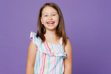 Little cheerful cute kid child girl 5-6 years old wears striped dress look camera with opened mouth smile isolated on plain pastel light purple background. Mother's Day love family lifestyle concept.