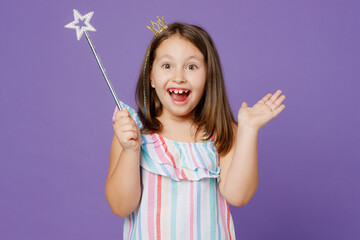 Little kid child girl 5-6 years old wears striped dress princess crown diadem hold magic wand fairy...