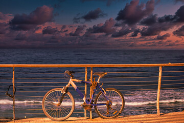 Fototapeta premium Alone forgotten bike near the seaside and concept of loneliness
